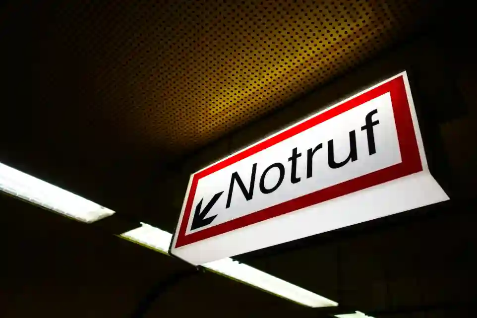 a red and white sign hanging from the ceiling